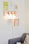 DIY wall-mounted lamp made from brass taps