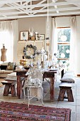 Festively set dining table in eclectic interior decorated for Christmas