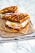 Parmesan waffles with ham, cheese and fried egg