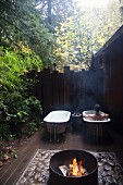 Outdoor fireplace and bathtubs, California
