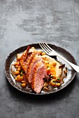 Duck breast with spiced jus and chickpea cream