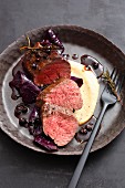 Saddle of venison with red cabbage and juniper berries