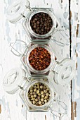 Various spices in storage jars (seen from above)