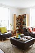 Dark brown leather furniture, rug and wooden corner shelves between pale lattice windows in comfortable living room