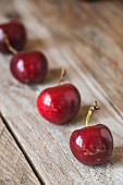 Ripe cherries on a wooden table