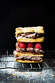 Mille feuilles with chocolate cream, raspberries and icing sugar