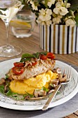 Mediterranean chicken breast fillet with cherry tomatoes on lemon polenta with mushrooms