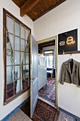 View into vintage-style apartment through door and lattice window