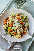 Butternut squash and pea risotto with grated cheese