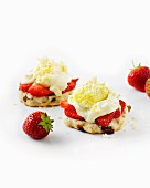 Clotted cream and strawberries on scones