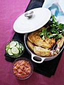 Braised chicken with a cucumber salad and a spicy fruit sauce
