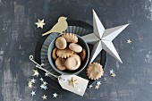 Christmas biscuits on flan tin and stars hand-crafted from paper and gold foil