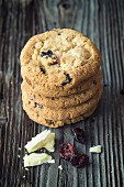 A stack of cookies with white chocolate and dried craberries