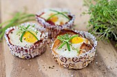 Baked eggs with bacon in paper cases