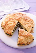 Pancake lasagne with spinach and feta cheese, sliced