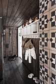 Rustic hallway with dark board floor, ceiling and walls