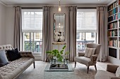 Pale upholstered seating in elegant living room