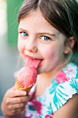 A little girl eating an ice cream