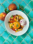 Peaches in syrup with hazelnuts, peppermint and ice cream