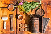 An arrangement of wild flowers and an antique tools (seen from above)