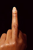 A woman's hand with the middle finger extended