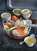 Raw vegetables with various dips