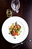 Grilled octopus with vegetables and white wine