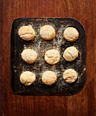 Freshly baked scones on a baking tray (seen from above)