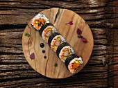 Futomaki sushi with shrimps, caviar and avocado