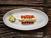 Sushi with tuna fish, chilli mayonnaise and herbs