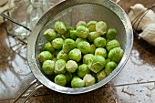 Washed Brussels sprouts in a sieve