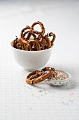 Salted pretzels with chocolate and sugar sprinkles