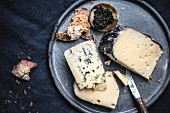 A cheese platter with caviar and bread (seen from above)
