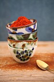 Saffron powder in a stack of ceramic bowls
