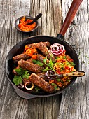 Cevapcici sausages with tomato rice