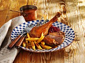Roast goose with potato orzo pasta and red cabbage
