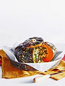 Whole baked pumpkin with brown rice