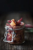 A jar of pear and red onion chutney