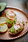 Bruschetta topped with salmon and avocado