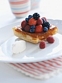 A puff pastry with strawberries, blueberries and raspberries