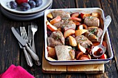 Baked pork loin with plums and rosemary