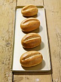 Four fresh bread rolls