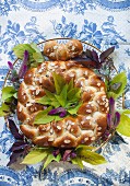 A yeast wreath with poppyseeds and flaked almonds