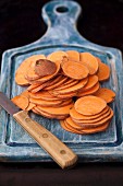 Sweet potato slices on a chopping board