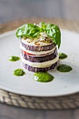 An aubergine tower with mozzarella, tomatoes and basil