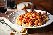 Pasta shells with pork ribs and tomato sauce