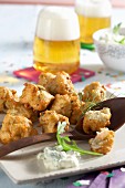 Spicy crab fritters with rocket dip