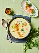 Cream of asparagus soup with salmon and dill
