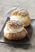 Profiteroles with nut brittle and whipped cream