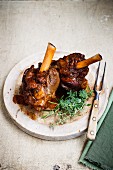 Braised lamb knuckles with herbs
